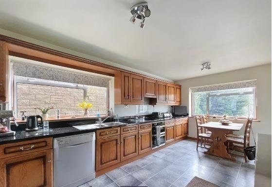 The breakfast kitchen overlooks the rear garden and is flooded with natural light.. Fitted storage cupboards and drawers, an integral fridge and a four ring hob sitting above a grill and oven are among its features. There is space for a breakfast table.