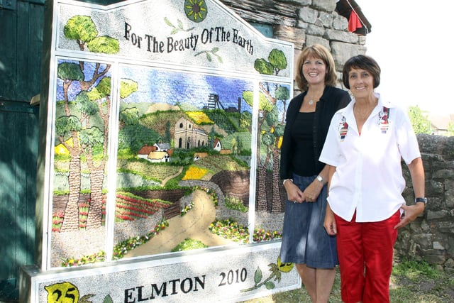 Karen Shacklock and Sue Broomhead with the finished well dressing in Elmton in 2010.