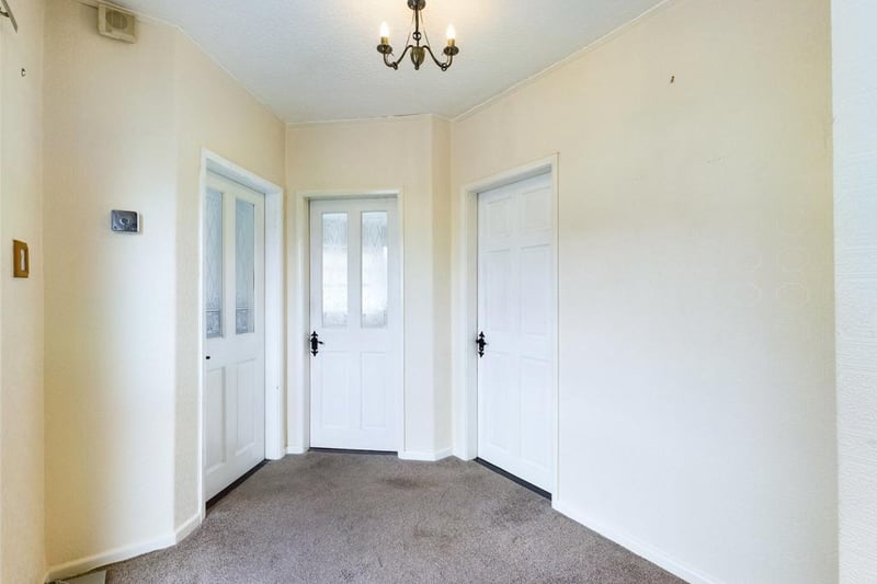 Spacious entrance hall with double glazed door and  window.
