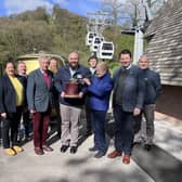Andy Gaskell, Guy Slater, Sophie Pugh, David Webster, Andrew Pugh, Stephen Scott, Adam Bowling (with cake), Bradley Jenkins, Vanessa Pugh, Rupert Pugh and Tim Peet, left to right, celebrate the cable cars' 40th birthday at the Heights of Abraham, Matlock Bath.