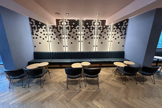 The coffee shop has been designed in a way that ensures plenty of light for customers to enjoy. Apart from large windows, the café has light-up wall elements and over-the-head lights for gloomy days and evenings.