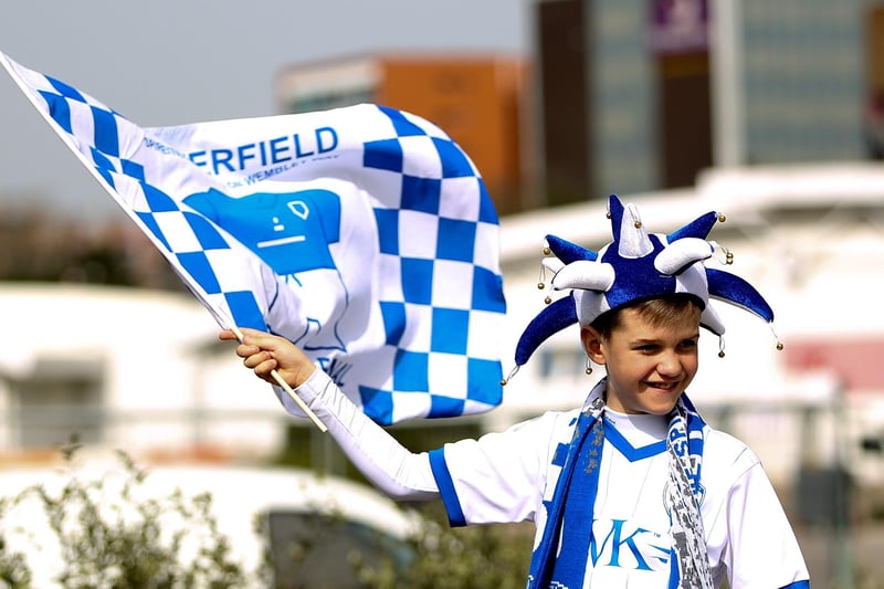 A young Chesterfield fan waves a flag prior to the Johnstone's Paint Trophy Final between Chesterfield and Peterborough United at Wembley Stadium in 2014.