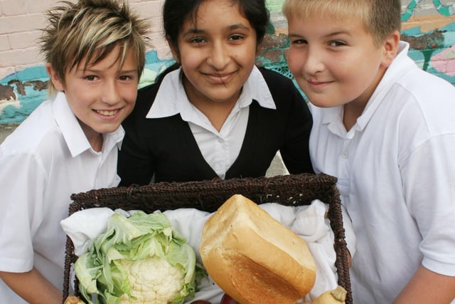Louis McAndrew, Haleema Sharif, Josh Evell at Abercrombie Primary School, Chesterfield with their harvest goods for the elderly in 2008.
