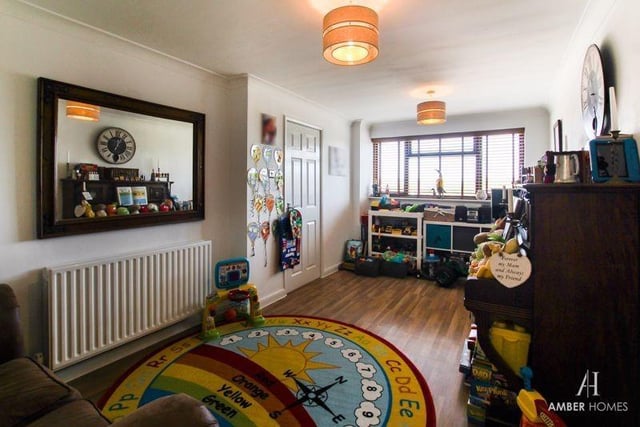A second reception room on the ground floor is this dining room, which is currently being used a a playroom for the kids. Versatile, it occupies the left-hand portion of the house.