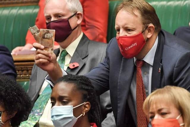 Chesterfield's Toby Perkins was among angry MPs on Wednesday, brandishing cash at the Government in reference to Owen Paterson's paid lobbying.