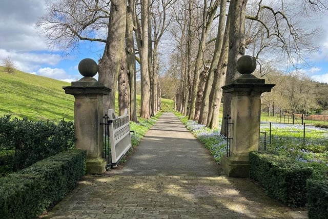 The house is approached through a pair of stone gateposts onto a tree lined drive leading to a further gate and a gravelled driveway.