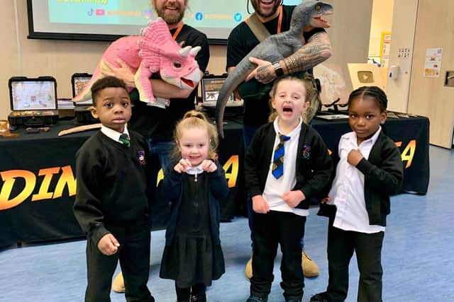 Pupils Owen, Lyla, Shayla and Eloghosa with the 'baby' dinosaurs at Dinomania