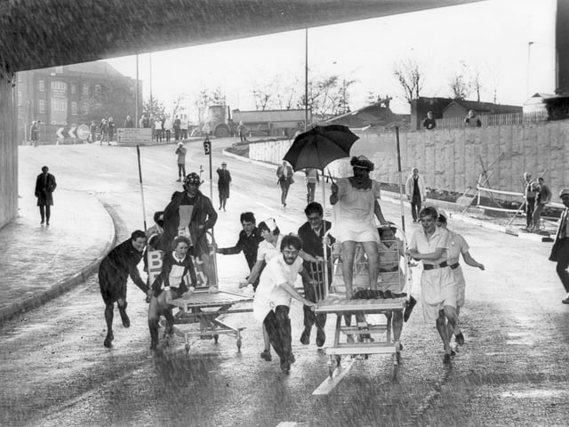 Chesterfield Royal Hospital nurses and Chesterfield police officers have some fun before the opening of the town's Inner Ring Road - December 1984
