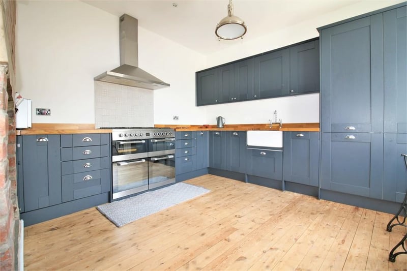 The recently fitted kitchen has a range cooker, integrated dishwasher, Belfast sink and integrated fridge freezer.