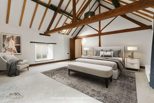 The master bedroom is a majestic sight, especially with its exposed beams