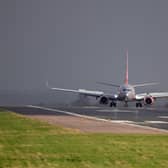 G-DRTW in front of heavy rain storm at East Midlands airport