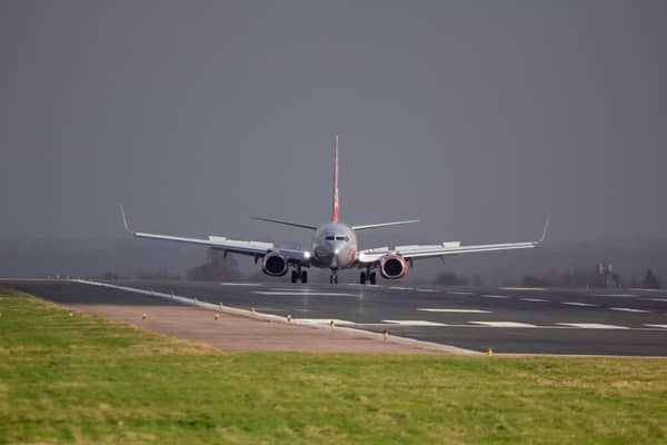 G-DRTW in front of heavy rain storm at East Midlands airport