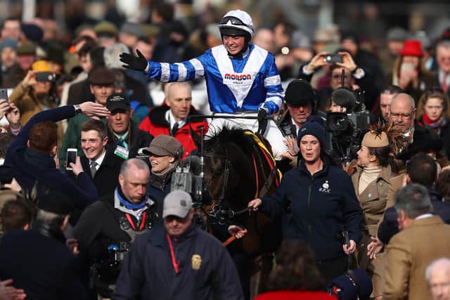 Jockey Bryony Frost salutes the crowds on Frodon as they walk back to the winner's enclosure after last year's Ryanair Chase.