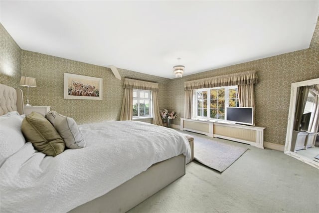Four double bedrooms are contained within the house. The principal bedroom has a dressing room.