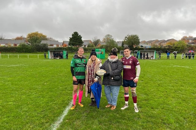 Amanda Hall and Sophie Dudley from Ashgate Hospice's virtual ward with rugby players at the match between Dronfield and Morley.