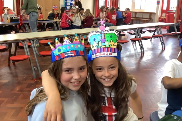 Millie and Frankie enjoy the celebrations at Christ Church C of E Primary School. The day saw over 200 members of the local community celebrating the jubilee, with each class singing and dancing to songs from every decade of her reign.