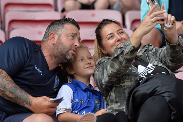 A family of Wednesday supporters take a selfie at Wigan Athletic's DW Stadium.