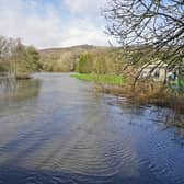 The River Amber at Ambergate - pictured here after flooding last year - is still subject to a flood warning.