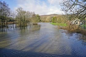 The River Amber at Ambergate - pictured here after flooding last year - is still subject to a flood warning.