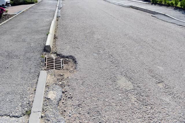 One resident of the Regents Green development in Grassmoor says the unfinished roads and pavements "could cause injury or damage to vehicles"