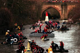 Some of the hardy competitors as they leave Matlock in the annual Boxing day charity raft race.h