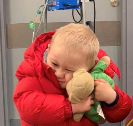 Little Stan with the teddy bear he got from NHS staff at the Royal after his treatment.
