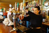 Emma Rose pouring a pint at Sorbo