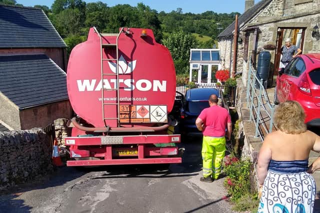 Highways workers are diverting traffic after a lorry has broken down and is blocking The Bank in Bonsall.