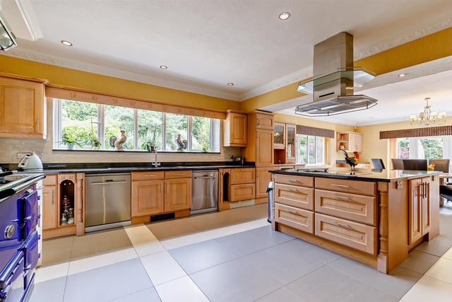 The kitchen has double French doors leading to the rear garden and features a gas fired Aga.