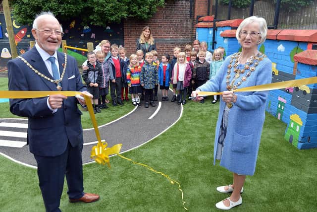 Henry Bradley Infant School's playground has been officially opened by the Mayor of Chesterfield Coun Glenys Falconer and consort Keith Falconer, pictured cutting the ribbon for the infant play area