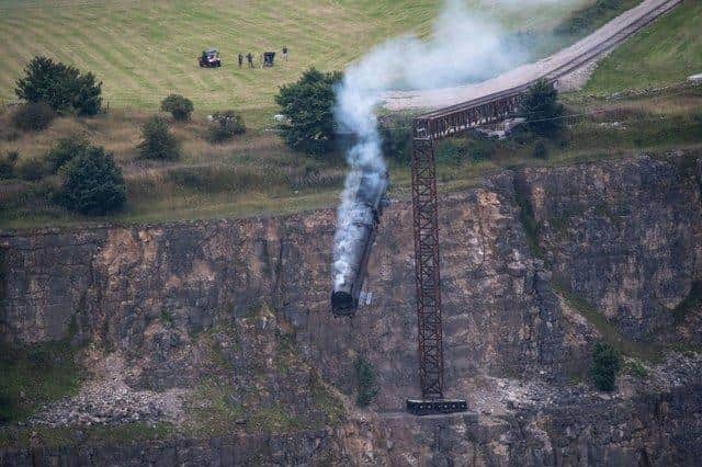 Peak District photographer Villager Jim shared this photo of the Mission: Impossible 7 film shoot of the train going over the edge of the former Darlton Quarry (photo: www.facebook.com/VillagerJim)
