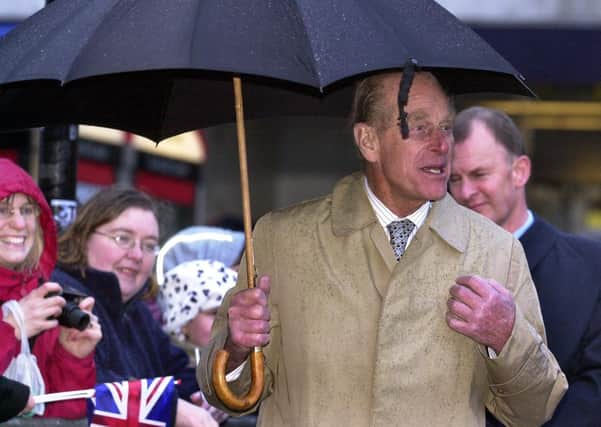 The Duke of Edinburgh braving the rain in Chesterfield in 2003.