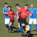 Action from Grassmoor Sports Res (in red) against Walkers Wanderers. All photos by Martin Roberts.