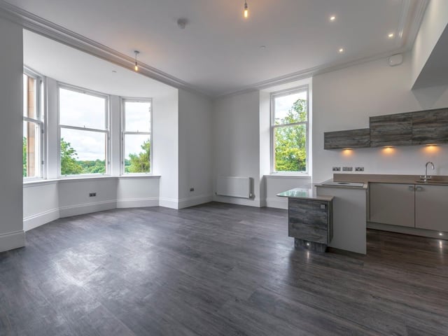 The open plan living room is also home to the modern kitchen.