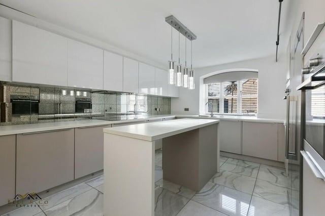 The kitchen at the Forest Hill Park house is strikingly modern. It comes complete with two ovens, a washing machine, dishwasher and American-style fridge/freezer