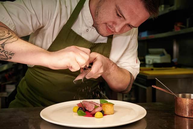 Head chef Adam Harper prepares food for The Gallery Restaurant at the Cavendish Hotel, Baslow.