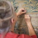 Conservation work on the Gideon Tapestries involved stitching by hand.