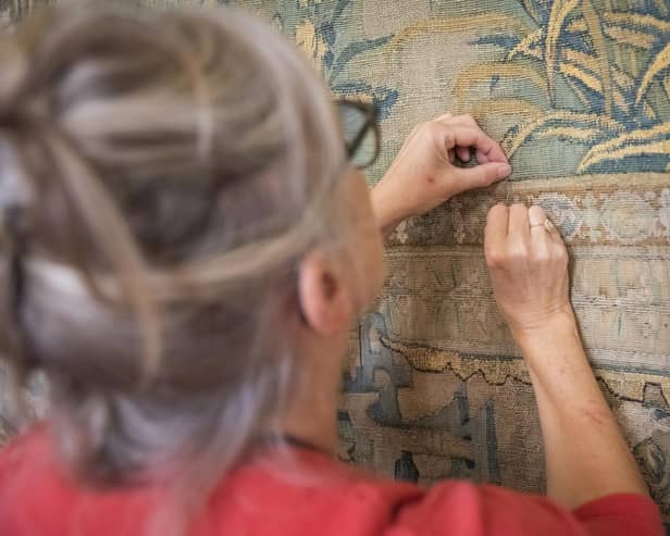 Conservation work on the Gideon Tapestries involved stitching by hand.