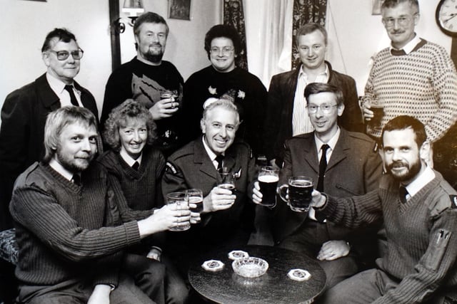 Memebers of the Royal Observer Corps raise a glass in 1991.