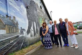Sam Fox, Lisa Powell, Richard Street, Valerie Meredith, Brenda Kelly and Mark Hinman council chair pictured with the new mural outside the Pinxton Parish Council officers on Kirkstead Road