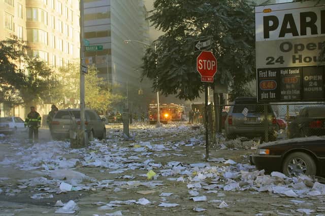 Debris covers the streets around at the World Trade Center. (Photo by Ron Agam/Getty Images)