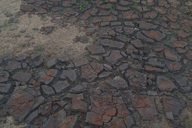Large parts of the Woodhead Reservoir in Peak District turned into cracked soil.