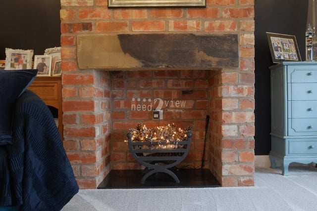 Here is a close-up of the exposed-brick feature fireplace in the second lounge. Get your slippers on and snuggle up!