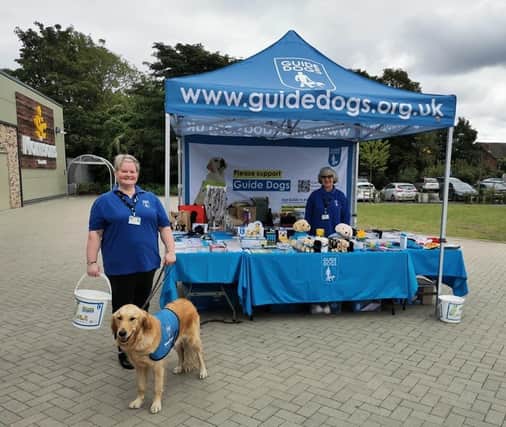 Kay, a Guide Dogs Chesterfield volunteer, and ambassador dog Val at a fundraiser in Bolsover.