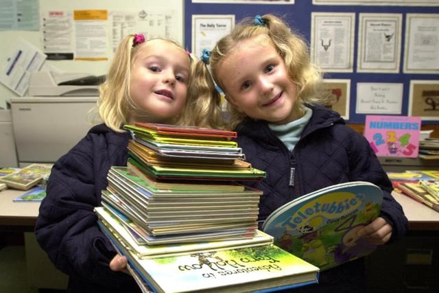 Twins Chelsea and Louise Askin aged four from Dunscroft. Enjoying a book fayre at Sheep Dip Lane Primary School in 2001.