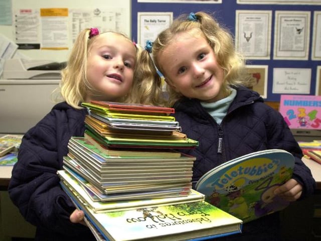 Twins Chelsea and Louise Askin aged four from Dunscroft. Enjoying a book fayre at Sheep Dip Lane Primary School in 2001.