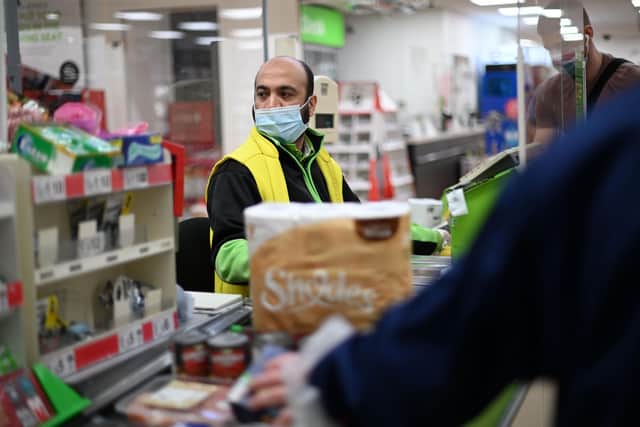 A recent union report has documented an increase in shopworkers being abused during the pandemic. (Photo by DANIEL LEAL-OLIVAS / AFP) (Photo by DANIEL LEAL-OLIVAS/AFP via Getty Images)