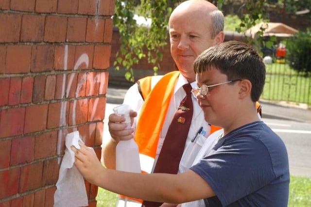 On August 11, 2004, there was an effort to remove graffiti in Carcroft. Here is 12 year old Phillip Goulding.