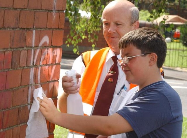On August 11, 2004, there was an effort to remove graffiti in Carcroft. Here is 12 year old Phillip Goulding.