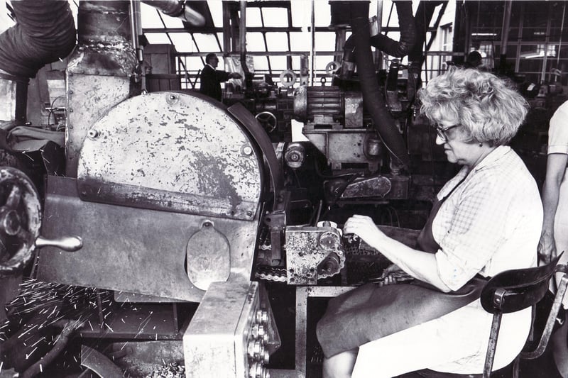 Pictured at work on a repoint cropping machine in the Roll Forge Department of Sheffield Twist Drill & Steel Co. Ltd., Summerfield Street, Sheffield, is Mrs Elsie Stones, a copy repoint machinist in August 1976